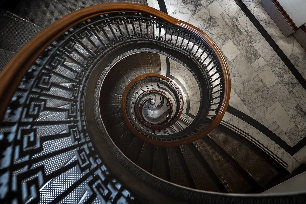 Spiral staircase symbolizing integral leadership and the ongoing journey of conscious growth